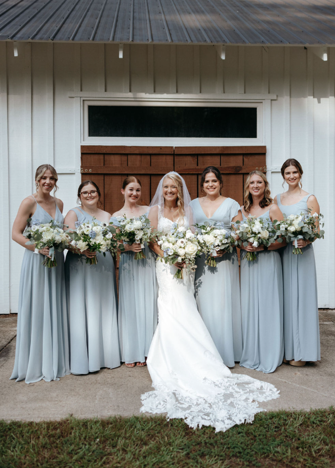 bride with bridesmaids in blue dresses